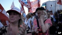 Supporters of Argentine Vice President Cristina Fernandez de Kirchner, a former president, cry after hearing the verdict and sentence in a conspiracy and fraud trial against her in Buenos Aires, Argentina, Dec. 6, 2022.