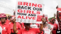FILE - Bring Back Our Girls campaigners in Lagos, Nigeria, in 2017, chant slogans during a protest calling on the government to rescue the remaining kidnapped girls of the government secondary school who were abducted in 2014.