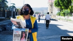A woman sells copies of Diario El Salvador, a newspaper funded by the Salvadoran government, in San Salvador, El Salvador, Nov. 9, 2022.