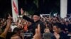 Malaysia's newly appointed Prime Minister Anwar Ibrahim waves to his supporters after his news conference in Sungai Long, Selangor, Nov. 24, 2022. 