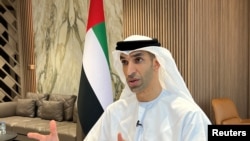 FILE - United Arab Emirates Minister of State for Foreign Trade Thani Al Zeyoudi gestures during an interview with Reuters in Dubai, United Arab Emirates, June 30, 2022. 