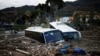 Bus rusak tertimbun puing-puing setelah tanah longsor di pulau wisata Ischia, Italia, 27 November 2022. (Foto: Reuters)