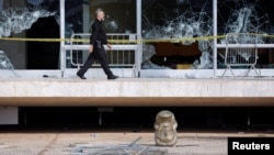 The head of a Lady Justice statue is seen on the floor following Brazil's anti-democratic riots, at the Supreme Court building in Brasilia, Brazil, Jan. 10, 2023. 