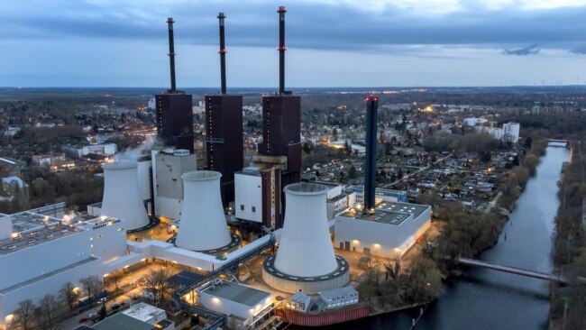 FILE - A cooling tower of the Lichterfelde gas-fired power plant is seen in Berlin, Germany, March 30, 2022.