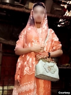 Rohingya refugee Mubina Khatoon, 13, poses for a photograph before boarding a Malaysia-bound boat, In Cox's Bazar, Bangladesh, Dec. 2, 2022. (Photo courtesy of family, and blurred at family's request)