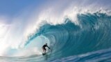 Surfer Balaram Stack rides a wave during the Da Hui Backdoor Shootout (in memory of Duke Kahanamoku) on the north shore of Oahu, Hawaii, Jan. 14, 2023.