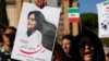 FILE - People protest the death of Mahsa Amini, a woman who died in police custody in Iran, during a rally in central Rome, Oct. 29, 2022.