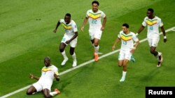 Kalidou Koulibaly celebrates scoring Senegal's second goal with teammates in a 2-1 victory over Ecuador at Khalifa International Stadium in Doha, Qatar, Nov. 29, 2022.