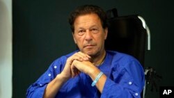 FILE - Former Pakistani Prime Minister Imran Khan is seen at Shaukat Khanum hospital, where he was being treated for a gunshot wound, in Lahore, Pakistan, Nov. 4, 2022.