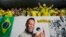 FILE: Brazil fans cheer by a banner celebrating Pele before the World Cup match between Brazil and South Korea at Al Rayyan, Qatar, Dec. 5, 2022.