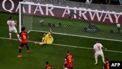 Belgium's goalkeeper #01 Thibaut Courtois (C) conceides a goal shot by Morocco's midfielder #11 Abdelhamid Sabiri (unseen) during the Qatar 2022 World Cup Group F football match.