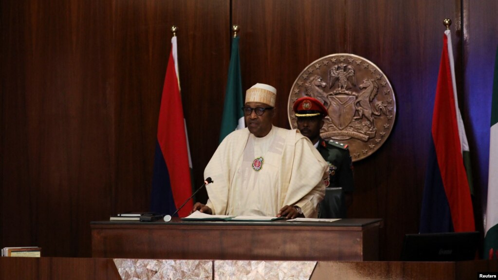 Nigerian President Muhammadu Buhari speaks during the launch of the new Nigerian currency in Abuja, Nov. 23, 2022. Buhari said, Nov. 30, 2022, the war between Russia and Ukraine is allowing arms and fighters to stream into the Lake Chad region.