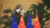 资料照：北京人大会堂展示的中国与欧盟旗帜。