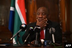 FILE - South Africa's President Cyril Ramaphosa speaks during a press conference in central London, Nov. 24, 2022.