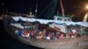 FILE - Rohingya refugees arrive on a boat in North Aceh, Indonesia, Dec. 30, 2021. A Rohingya activist group reported on Dec. 21, 2022, that a powerless boat carrying more than 150 Rohingya refugees was reported drifting up to three weeks in Indian waters without food and water.