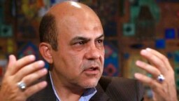 FILE - In this photo released by the KhabarOnline News Agency on June 12, 2019, Ali Reza Akbari speaks in an interview.