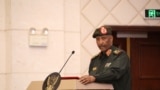 FILE - Sudan's military leader General Abdel Fattah al-Burhan stands at the podium during a ceremony to sign a framework agreement between military rulers and civilian powers in Khartoum, Sudan. Taken Dec. 5, 2022.