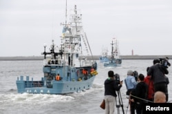 FILE - Whaling ships which are set to join the resumption of commercial whaling leave a port in Kushiro, Hokkaido Prefecture, Japan, July 1, 2019.