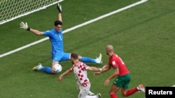 Morocco's goalkeeper Yassine Bounou blocks a shot by Croatia's attacking midfielder Nikola Vlasic during the first Group F fixture between Morocco and Croatia at the 2022 FIFA World Cup, Qatar, November 23, 2022