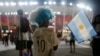 An Argentina soccer fan from India waits outside before the World Cup group C soccer match between Poland and Argentina at the Stadium 974 in Doha, Qatar, Nov. 30, 2022. 