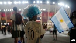 An Argentina soccer fan from India waits outside before the World Cup group C soccer match between Poland and Argentina at the Stadium 974 in Doha, Qatar, Nov. 30, 2022. 