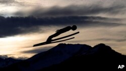 Anze Lanisek of Slovenia flies through the air during the first stage of the 71st Four Hills ski jumping tournament in Oberstdorf, Germany.