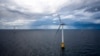 Hywind Scotland, the world's first commercial wind farm using floating wind turbines, is visible off the coast of Scotland in August 2017. Dec. 6, 2022, marks the first-ever U.S. auction for leases to develop commercial-scale floating wind farms off the West Coast. 