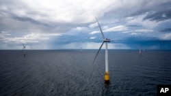 Hywind Scotland, the world's first commercial wind farm using floating wind turbines, is visible off the coast of Scotland in August 2017. Dec. 6, 2022, marks the first-ever U.S. auction for leases to develop commercial-scale floating wind farms off the West Coast. 