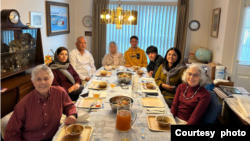 The Pennsylvania family of Judith Samkoff, front right, invited an Afghan refugee family to join them for their first Thanksgiving in the United States. (Photo courtesy of the Jewish Federations of North America)