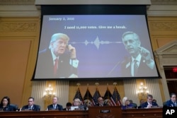 A video presentation plays as the House select committee investigating the Jan. 6 attack on the U.S. Capitol holds its final meeting on Capitol Hill in Washington, Dec. 19, 2022.
