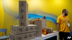 Packaging made from leaves is on display at the Releaf Paper booth during the CES tech show, Jan. 5, 2023, in Las Vegas. The Russian invasion of Ukraine forced Valentyn Frechka to relocate to France, but he says his Releaf paper company has never stopped production.