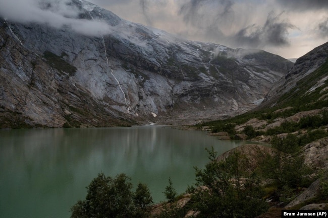 The Nigardsbreen glacier in Jostedal, Norway on August 5, 2022. The glacier has lost almost three kilometers in length in the past century due to climate change. (AP Photo/Bram Janssen)