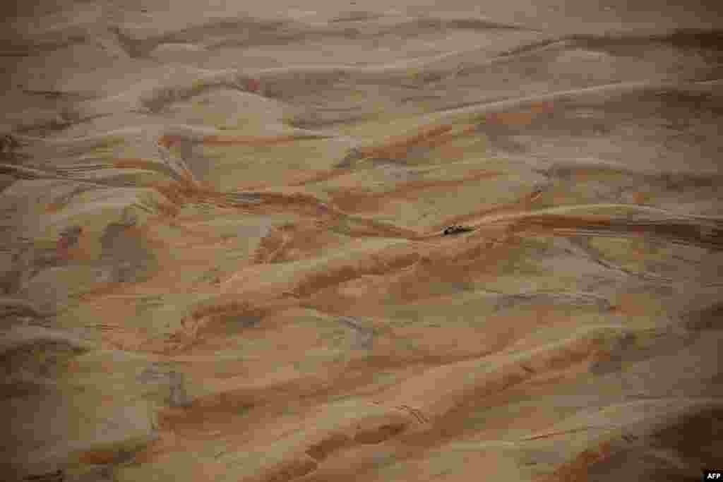 Toyota&#39;s Argentinian driver Juan Cruz Yacopini and Spainish co-driver Daniel Oliveras Carreras compete during Stage 8 of the Dakar 2023 between Al Duwadimi and Riyadh, Saudi Arabia.