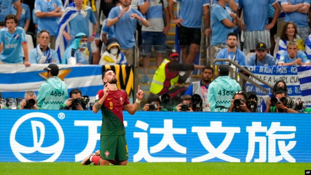 Portugal's Bruno Fernandes celebrates his side's second goal on a penalty during the World Cup group H soccer match between Portugal and Uruguay, at the Lusail Stadium in Lusail, Qatar, Nov. 28, 2022. 
