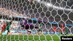 Cameroonian goalkeeper Andre Onana saves a shot taken by Swiss winger Ruben Vargas during a Group G opening match between Cameroon and Switzerland at the 2022 FIFA World Cup, Qatar, November 24, 2022.