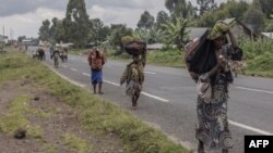 FILE: Displaced people who fled clashes between the Congolese army and M23 rebels try to timidly return to their homes in Kibumba, a few kilometres from the city of Goma in eastern Democratic Republic of Congo. Taken Jun.1, 2022. 