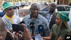 South African President Cyril Ramaphosa speaks to the media after leaving an African National Congress (ANC) National Executive Committee meeting in Johannesburg, Dec. 4, 2022.