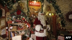 Despite its location in Jerusalem, the home of Palestinian Issa Kassissieh, dressed as Santa Claus, looks like it could be Santa's North Pole workshop on Nov. 30, 2022.