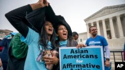 FILE - Students rally as the Supreme Court hears arguments on cases about affirmative action in college admissions, in Washington, Oct. 31, 2022.