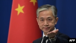 FILE - Chinese Foreign Ministry spokesman Wang Wenbin in Beijing, Nov. 9, 2020. After London and Toyko described China as a "challenge" in the Asia-Pacific region, Wenbin said in January 2023 that "China is a partner for cooperation for all countries instead of a challenge.” 