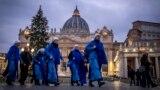 Nuns arrive at dawn to view the body of Pope Emeritus Benedict XVI as it lies in state in St. Peter's Basilica at the Vatican, Jan. 3, 2023. The Vatican announced that his funeral will be held on Jan. 5, 2023.