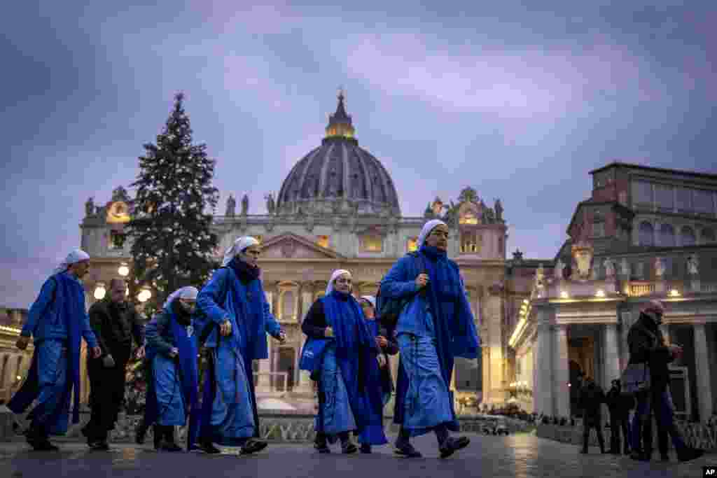 Nuns arrive at dawn to view the body of Pope Emeritus Benedict XVI as it lies in state in St. Peter&#39;s Basilica at the Vatican. The Vatican announced that his funeral will be held on Jan. 5, 2023.