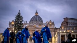 Nuns arrive at dawn to view the body of Pope Emeritus Benedict XVI as it lies in state in St. Peter&#39;s Basilica at the Vatican. The Vatican announced that his funeral will be held on Jan. 5, 2023.