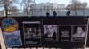 FILE - Signs and pictures of those killed, including journalist Brent Renaud, are displayed on a fence during a protest against Russia's invasion of Ukraine in Lafayette Park near the White House, March 13, 2022, in Washington. 