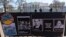 FILE - Signs and pictures of those killed, including journalist Brent Renaud, are displayed on a fence during a protest against Russia's invasion of Ukraine in Lafayette Park near the White House, March 13, 2022, in Washington. 