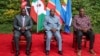 Kenya's President William Ruto, left, Burundi's President and summit chairperson Evariste Ndayishimiye, center, and Kenya's former President and summit facilitator Uhuru Kenyatta pose for a photo ahead of their meeting at a hotel in Nairobi, Kenya, Nov. 28, 2022.