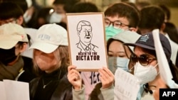 People gather to protest the Chinese governments continued continued zero-Covid policies at the University of California Berkeley campus in Berkeley, California, on November 28, 2022. 