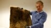 Patrick Janssen, co-founder of Dung Dung, shows a mat made from recycled human hair in Waremme, Belgium Dec. 8, 2022. REUTERS/Yves Herman