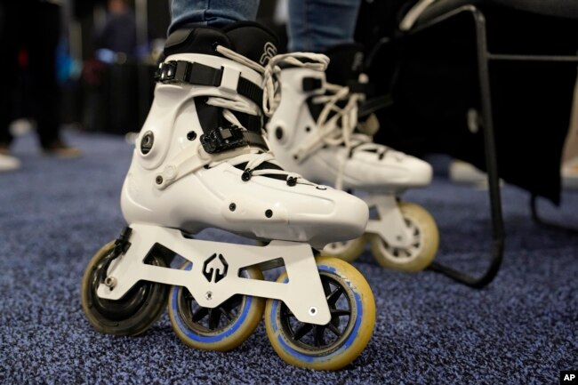 Mohamed Soliman of Atmos Gear shows off the Atmos Gear inline electric skates during CES Unveiled before the start of the CES tech show, Tuesday, Jan. 3, 2023, in Las Vegas. (AP Photo/John Locher)