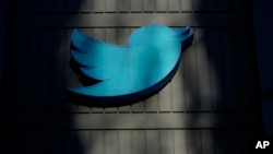 FILE - A sign at Twitter headquarters is shown in San Francisco, Friday, Nov. 18, 2022. (AP Photo/Jeff Chiu)